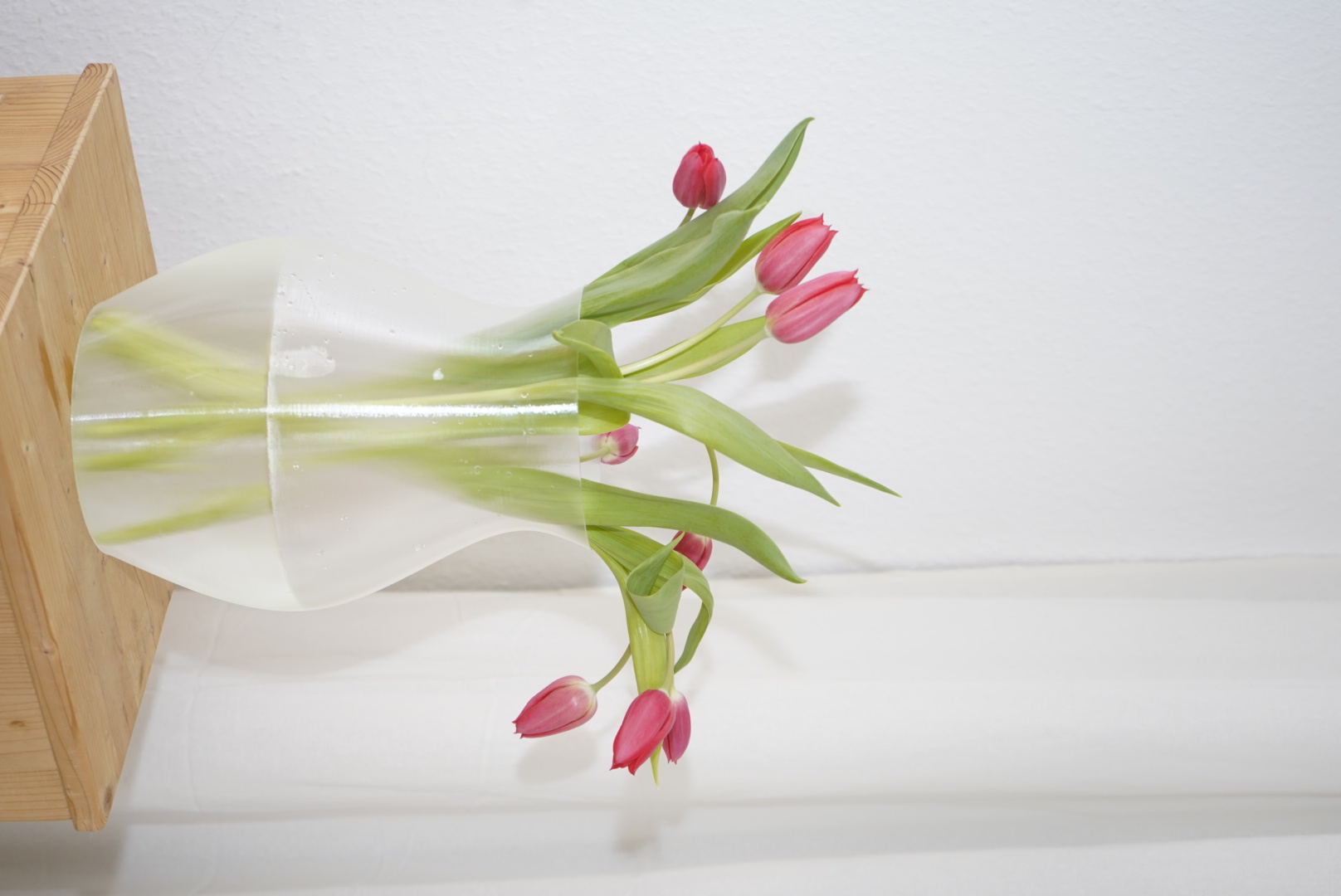 Clear vase with pink tulips